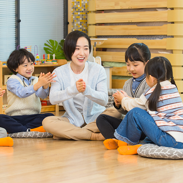 Early Childhood Educator playing with kids